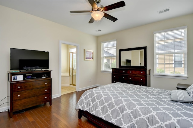 bedroom featuring connected bathroom, ceiling fan, and wood-type flooring