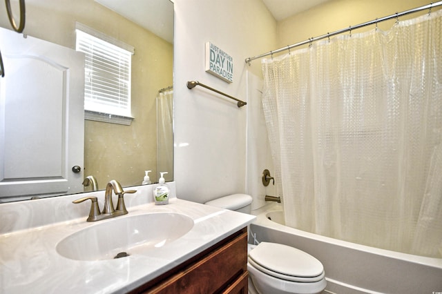 full bathroom with vanity, shower / bath combination with curtain, and toilet