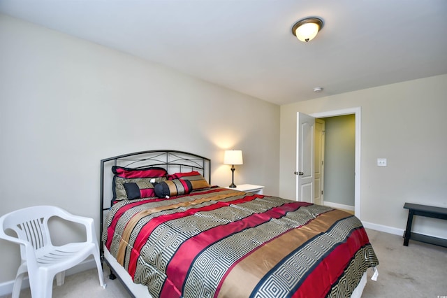 bedroom featuring light colored carpet