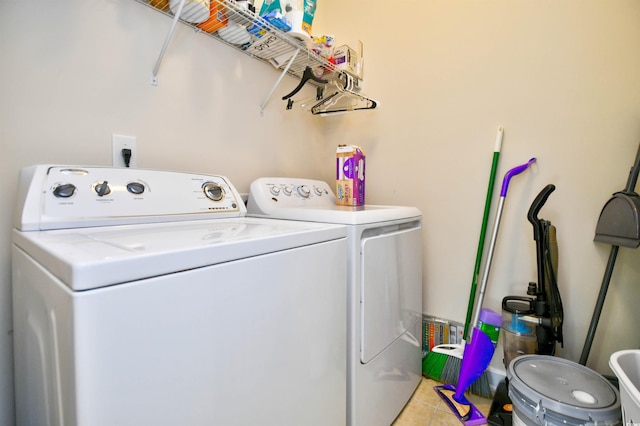 washroom featuring washer and dryer and light tile patterned floors