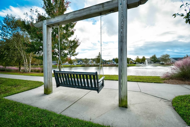 view of patio with a water view