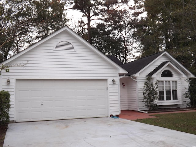 ranch-style house featuring a garage