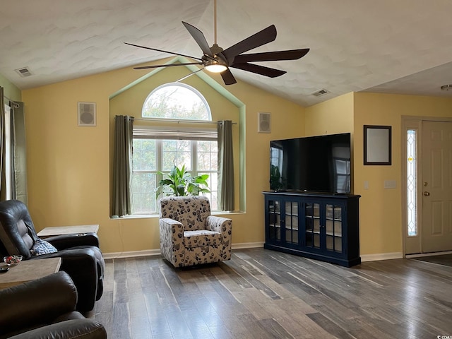 living room with ceiling fan, wood-type flooring, and lofted ceiling