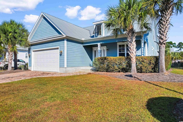 view of front facade with a garage and a front lawn