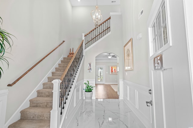 foyer with light wood-type flooring and a chandelier