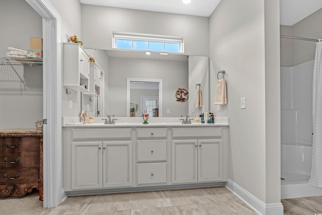 bathroom with vanity and curtained shower