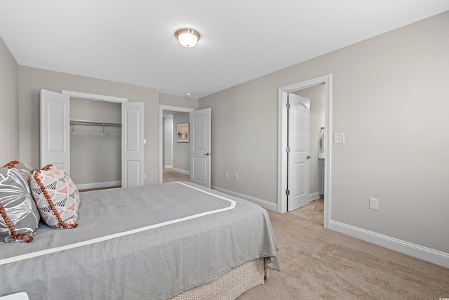 bedroom with light carpet and a closet