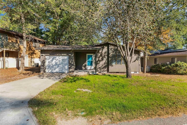 view of front of house featuring a front yard and a garage