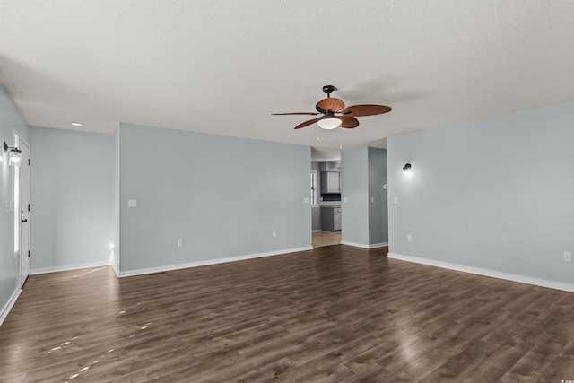 unfurnished living room with a textured ceiling, dark hardwood / wood-style floors, and ceiling fan