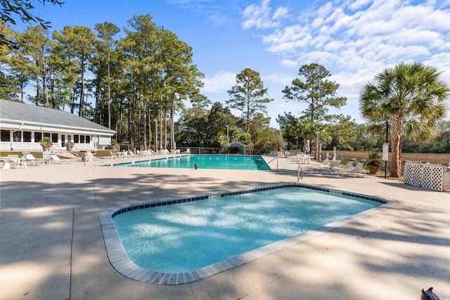 view of swimming pool featuring a patio