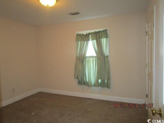 empty room featuring carpet floors