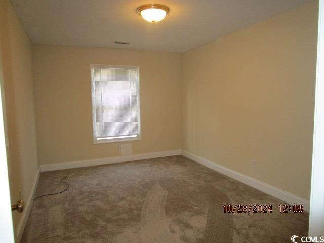 view of carpeted spare room