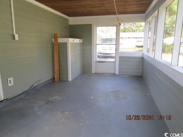 unfurnished sunroom featuring wooden ceiling