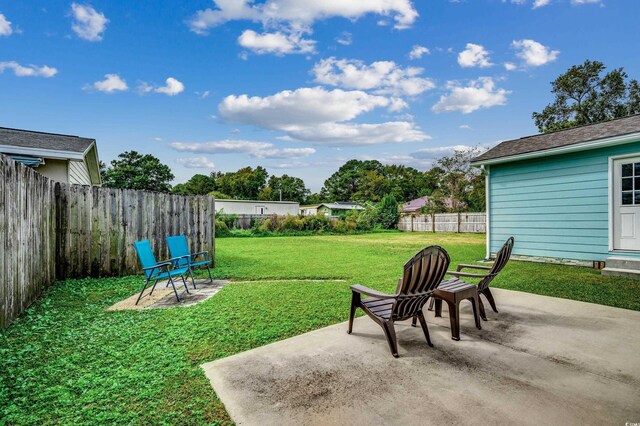 view of yard featuring a fenced backyard and a patio
