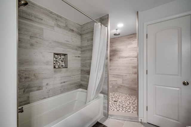 bathroom featuring wood walls, shower / tub combo, and tile patterned floors