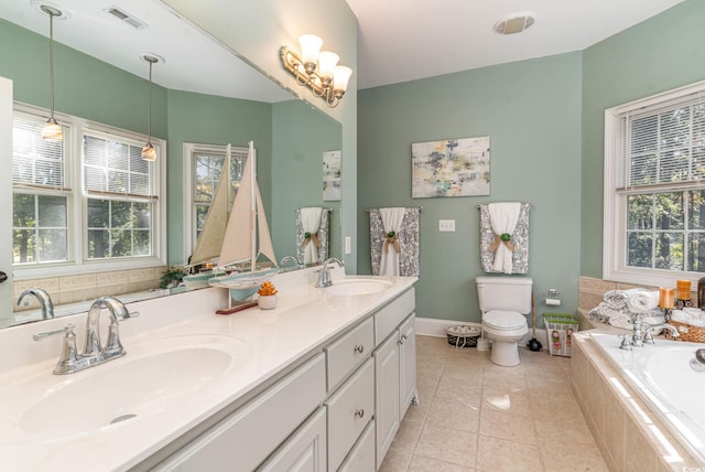 bathroom with a garden tub, a sink, visible vents, and tile patterned floors