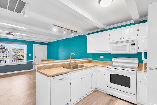 kitchen with light hardwood / wood-style floors, white cabinetry, sink, beam ceiling, and white appliances