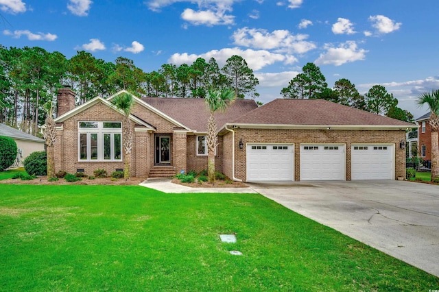 view of front facade with a garage and a front yard