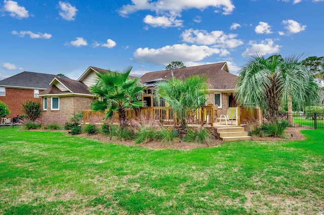 rear view of house with a lawn