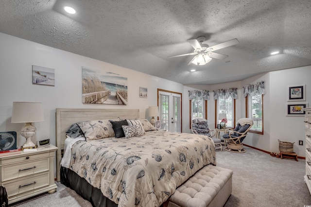 bedroom with multiple windows and a textured ceiling