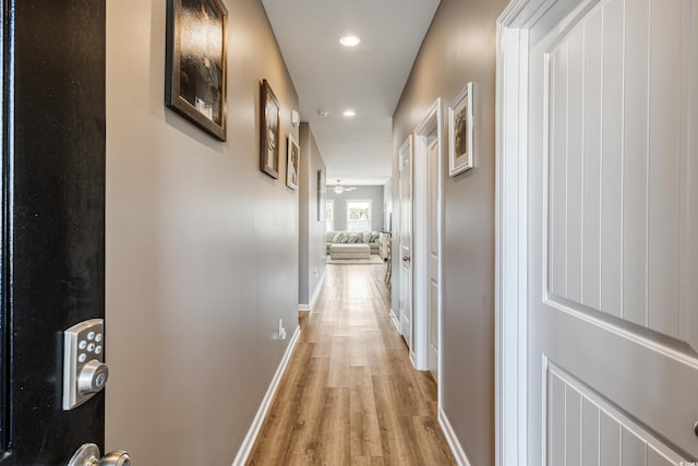 hall with light hardwood / wood-style flooring