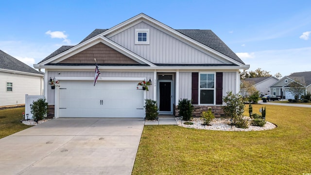 263 Red Maple Loop, Longs, SC 29568 - craftsman house featuring a front lawn, driveway, stone siding, board and batten siding, and an attached garage