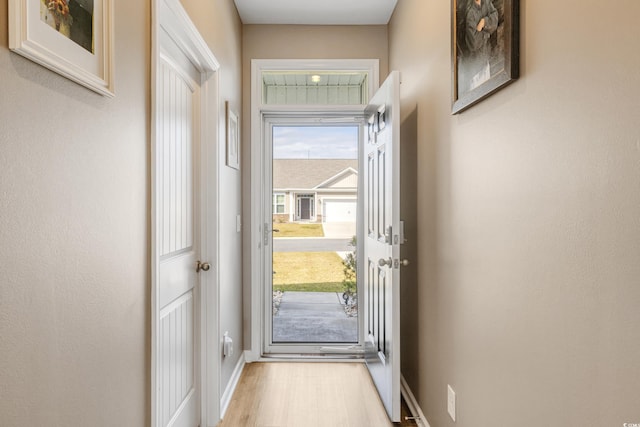 entryway with light hardwood / wood-style floors