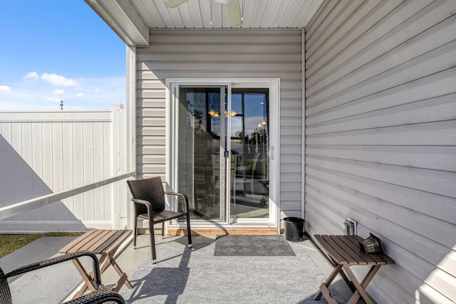 property entrance with ceiling fan and a patio