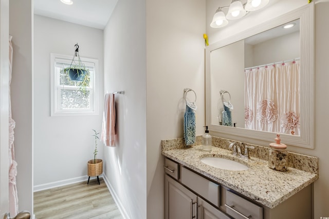 bathroom with vanity and hardwood / wood-style floors