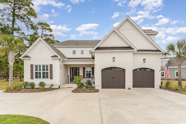 view of front of property featuring covered porch and a garage