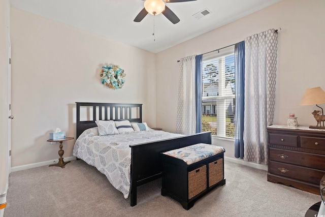 bedroom with light colored carpet and ceiling fan