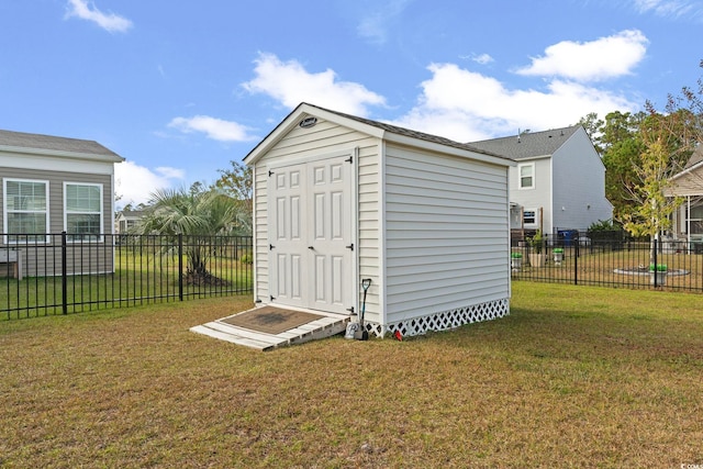 view of outbuilding with a lawn