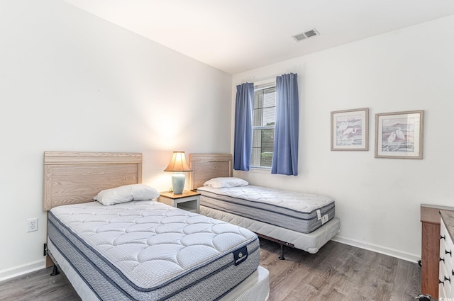 bedroom featuring dark wood-type flooring