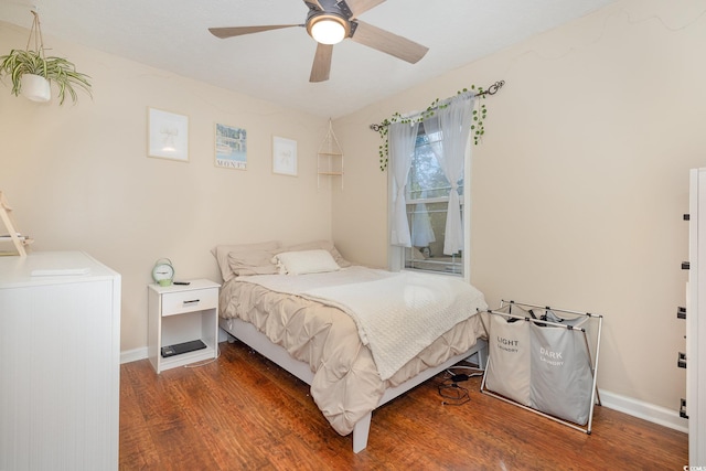 bedroom featuring dark wood-type flooring and ceiling fan