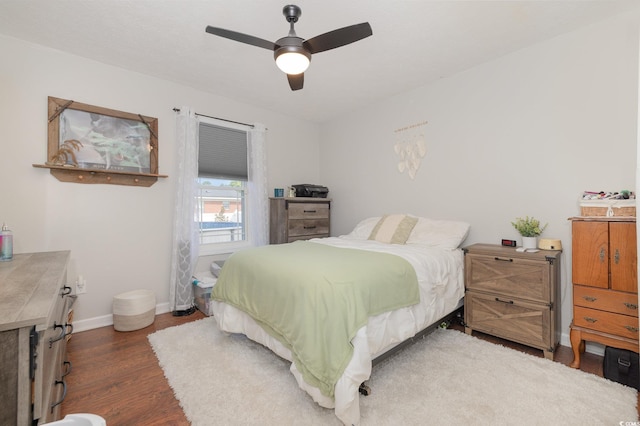 bedroom featuring dark wood-type flooring and ceiling fan