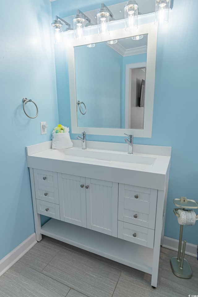 bathroom with vanity and crown molding