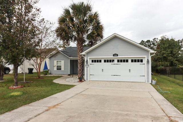 ranch-style home featuring a garage and a front lawn