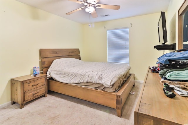 bedroom featuring ceiling fan and light colored carpet