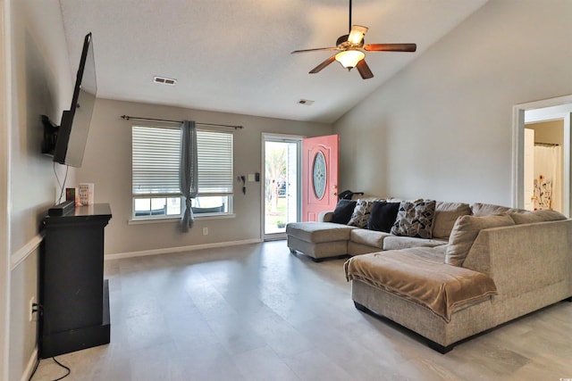 living room with vaulted ceiling and ceiling fan