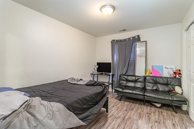 bedroom featuring wood-type flooring