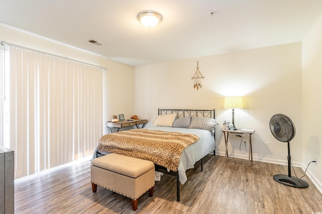 bedroom with wood-type flooring