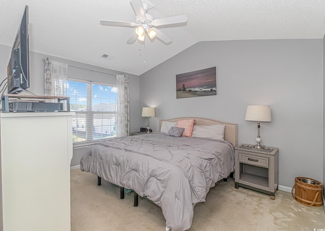 carpeted bedroom with lofted ceiling and ceiling fan