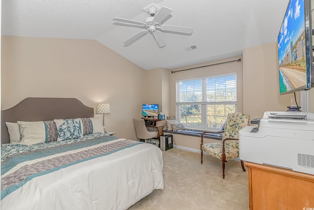 carpeted bedroom with vaulted ceiling and ceiling fan