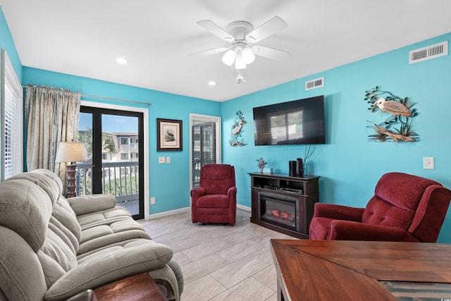 5601 N Ocean Blvd Unit C-202, Myrtle Beach, SC 29577 - living room with ceiling fan, recessed lighting, baseboards, and a glass covered fireplace