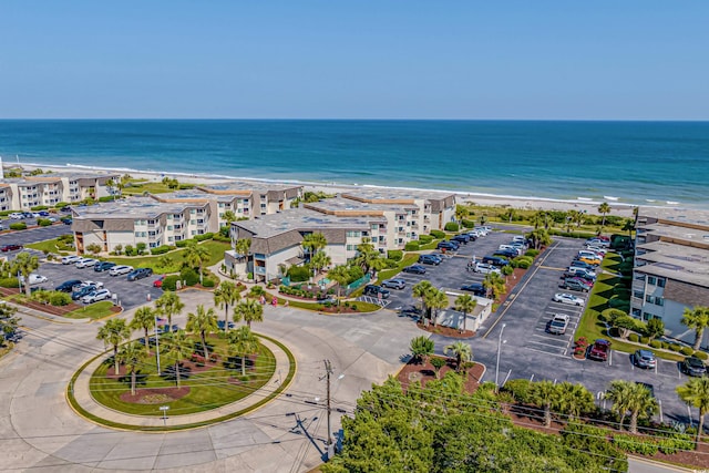 aerial view featuring a water view and a beach view