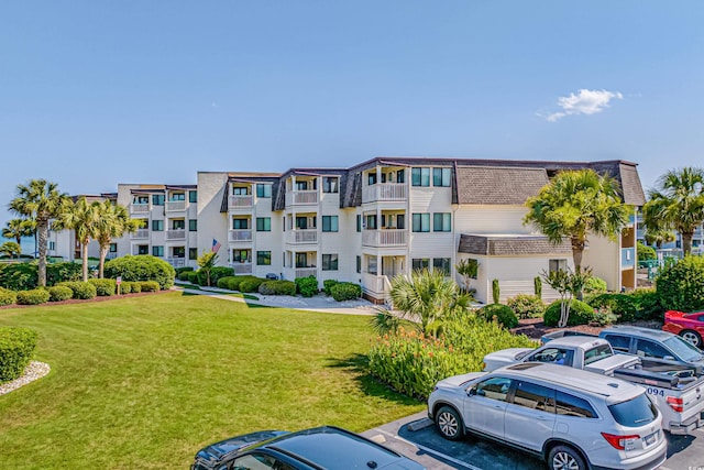 5601 N Ocean Blvd Unit C-202, Myrtle Beach, SC 29577 - view of apartment building / complex with uncovered parking