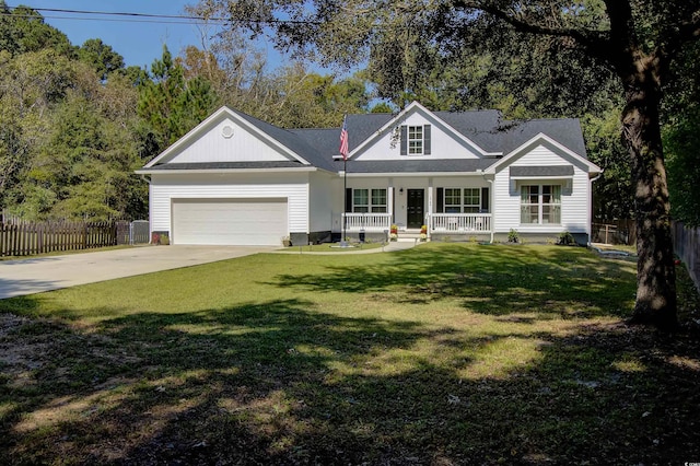 view of front facade with a porch, a garage, and a front yard