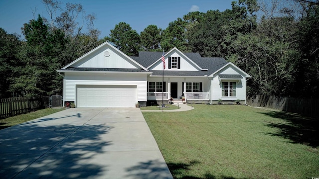 view of front facade with a porch, a garage, and a front lawn