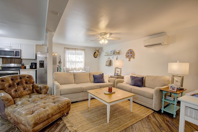 living room with an AC wall unit, ceiling fan, and dark wood-type flooring