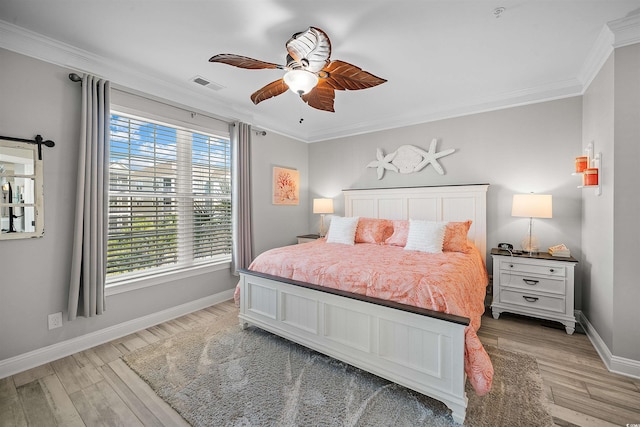 bedroom featuring ornamental molding, light hardwood / wood-style flooring, and ceiling fan